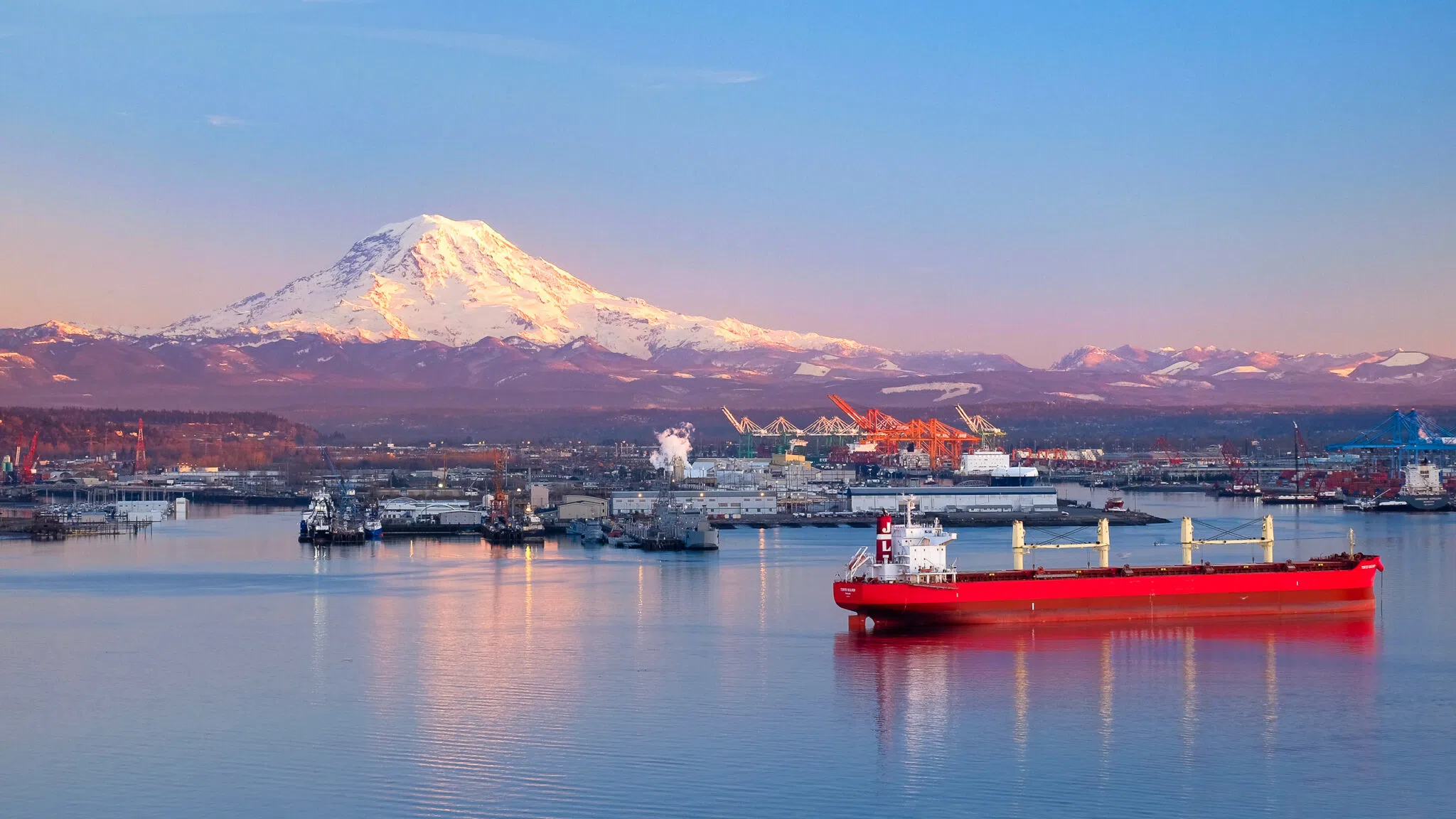 A vessel sails by the Port of Tacoma. (Photo: Shutterstock/Tobin Akehurst)